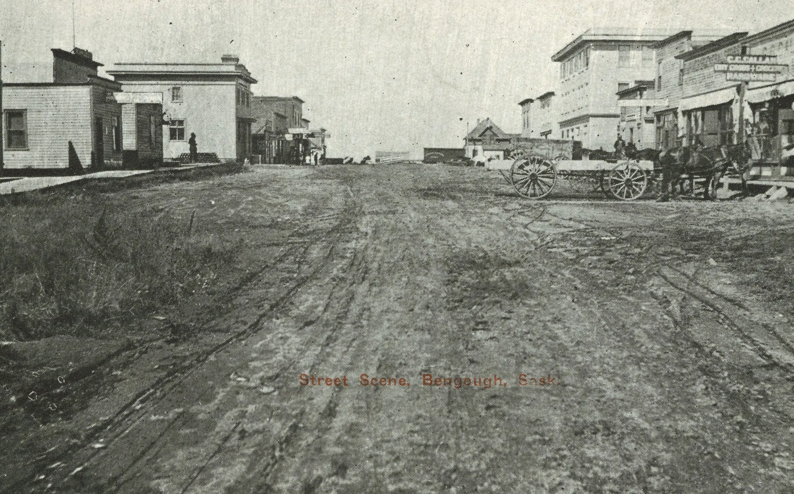 Street Scene, unpaved main street with horse-drawn wagon